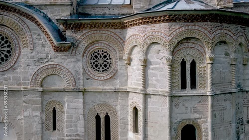 Beautiful rosettes carving on the walls of Christian orthodox church, tilt up, aerial view. The Ljubostinja Monastery, Serbia, XIV century photo