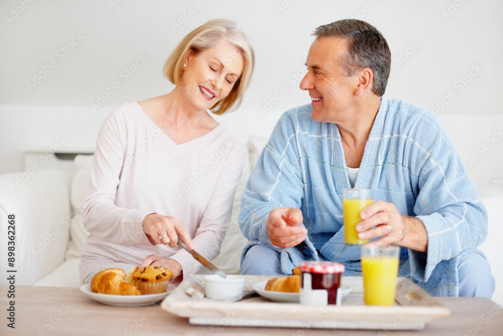 Mature couple, smile and breakfast together on sofa with bonding, diet nutrition and support in home. Happy, man and woman with morning meal, healthy food and romantic time for love relationship Mature couple, smile and breakfast together on sofa with bonding, diet nutrition and support in home. Happy, man and woman with morning meal, healthy food and romantic time for love relationship