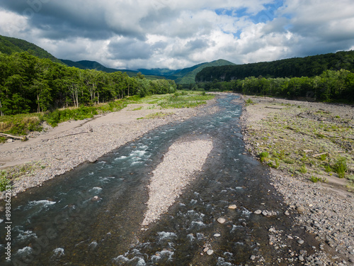 Hokkaido, Japan: Aerial view of the Chubetsu river in the Asahidake mountain in the Daisetsuzan volcanic Group near Asahikawa in Hokkaido on a cloudy summer day in Japan photo