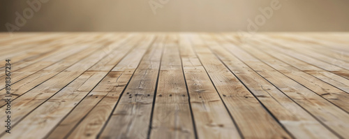 Warm beige wooden floors used horizontally to create a welcoming backdrop for website or wallpaper designs, with extra room for incorporating text or graphic elements.