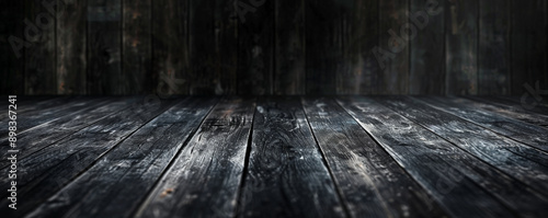 Dark charcoal wooden floors backdrop, providing a dramatic and striking background for your website or wallpaper designs with plenty of room for text or graphic elements.