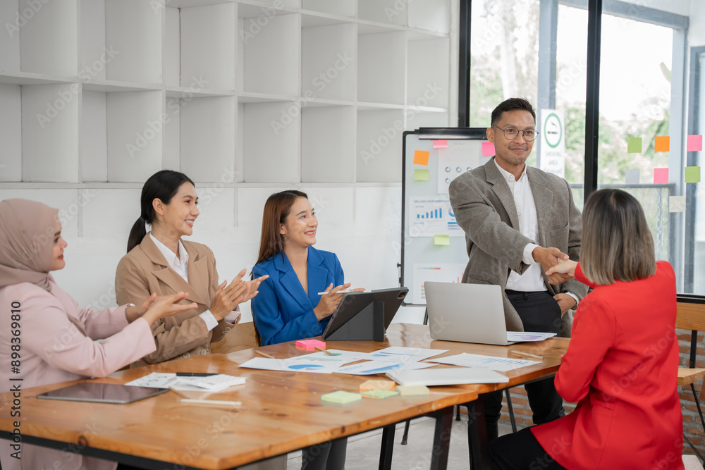 Asia business meeting consultations of business people in the company's meeting room. Asia business meeting consultations of business people in the company's meeting room.