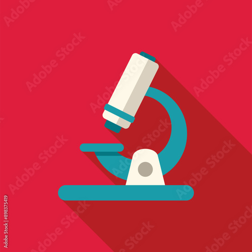Microscope standing on a red background casting a long shadow to the right
