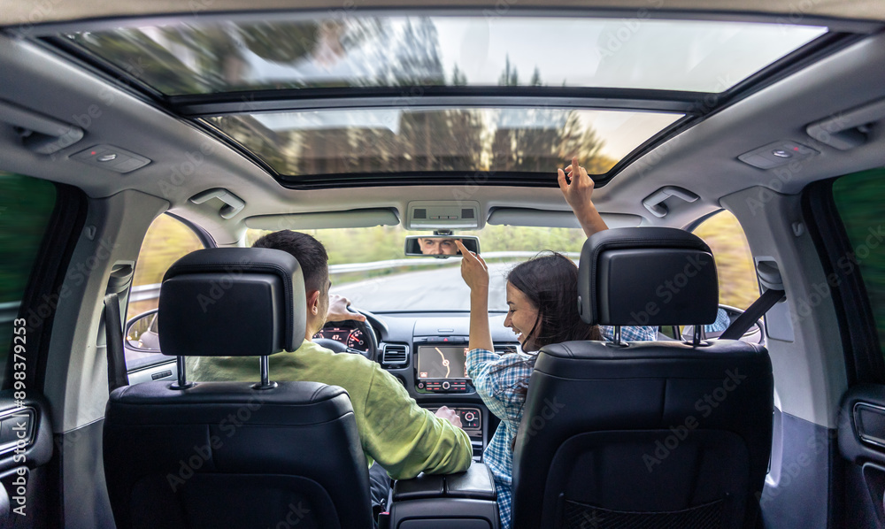 Man and woman traveling in car, sitting in car driving to travel destination. Man and woman traveling in car, sitting in car driving to travel destination.