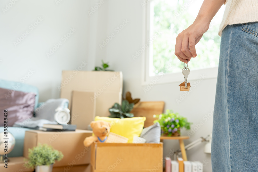 Moving house, relocation. Woman hold key house keychain in new apartment. move in new home. Buy or rent real estate. flat tenancy, leasehold property, new landlord, dwelling, loan, mortgage.. Moving house, relocation. Woman hold key house keychain in new apartment. move in new home. Buy or rent real estate. flat tenancy, leasehold property, new landlord, dwelling, loan, mortgage..
