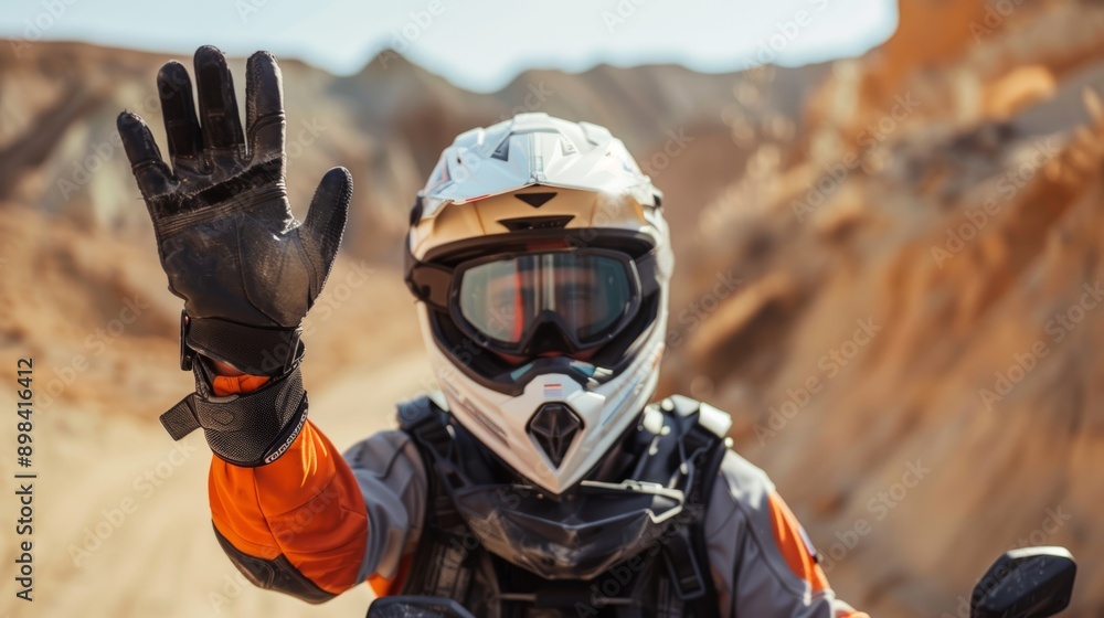 Naklejka premium Desert race, sand dunes training, motorbike arm stretch. High-energy dirt bike racer with extreme sports experience.