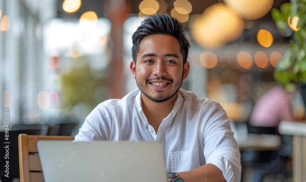 Office Working man, Smile is sitting in front of Laptop Computer in Office Environment Background Office Working man, Smile is sitting in front of Laptop Computer in Office Environment Background
