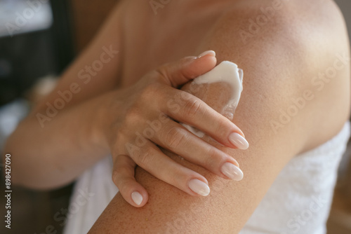 Photos close up female hands and a smear of cream  or lotion or serum  on the skin, wom