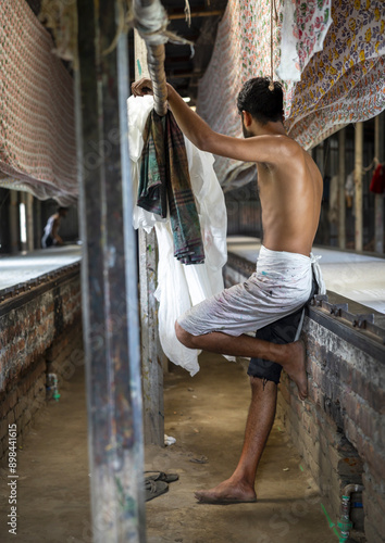 Bangladeshi worker in a block printing workshop, Dhaka Division, Rupganj, Bangladesh photo