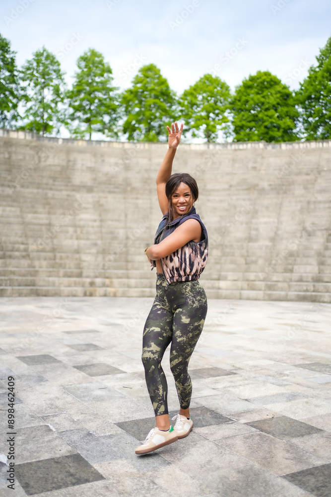 Latin woman dancing music in a park Latin woman dancing music in a park