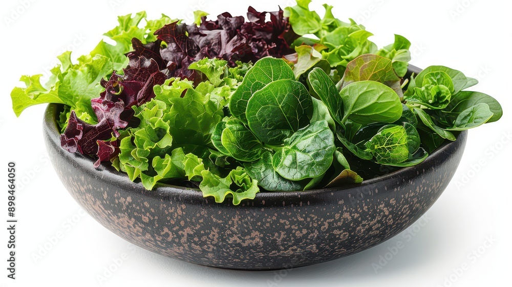 Fresh Mixed Greens in a Bowl on White Background Fresh Mixed Greens in a Bowl on White Background