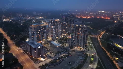 Wallpaper Mural Aerial footage of the Barrel Yards apartment complex illuminated at dusk in Waterloo, Canada Torontodigital.ca