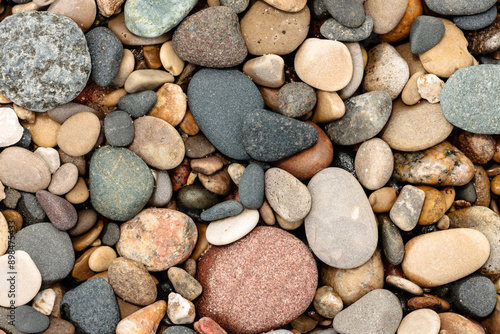 The many different stones deposted by Lake Michigan along the beach at Kohler Andrae State Park, Sheboygan, Wisconsin in early June photo