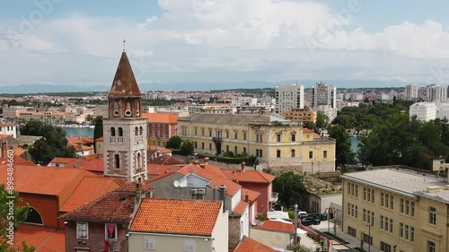 Wallpaper Mural Croatia. The video showcases the city's beautiful old town, with its many red-tiled roofs and a tall church tower in the foreground. Torontodigital.ca