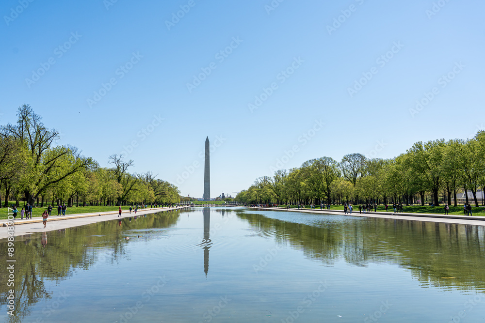 WASHINGTON, D.C. - April 10, 2023 : View of Washington Monument from the Lincoln Memorial in Washington, D.C. full of people during spring