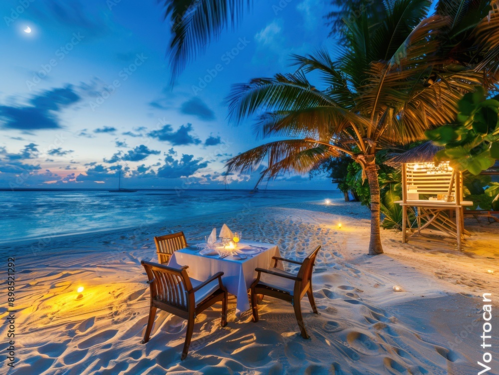 Fototapeta premium A romantic setup for a candlelit dinner on a tropical beach at twilight with the ocean in the background, creating a serene and intimate ambiance.