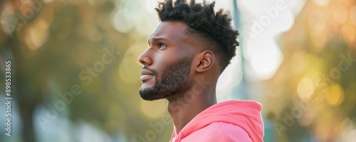 Serene Man in Bright Pink Practicing Mindfulness Walk for Mental Health Exercise © DigitalMagicVisions