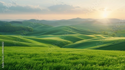 Rolling Green Field With Background Hills