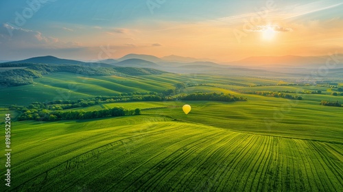 Green Field With Mountains in Background