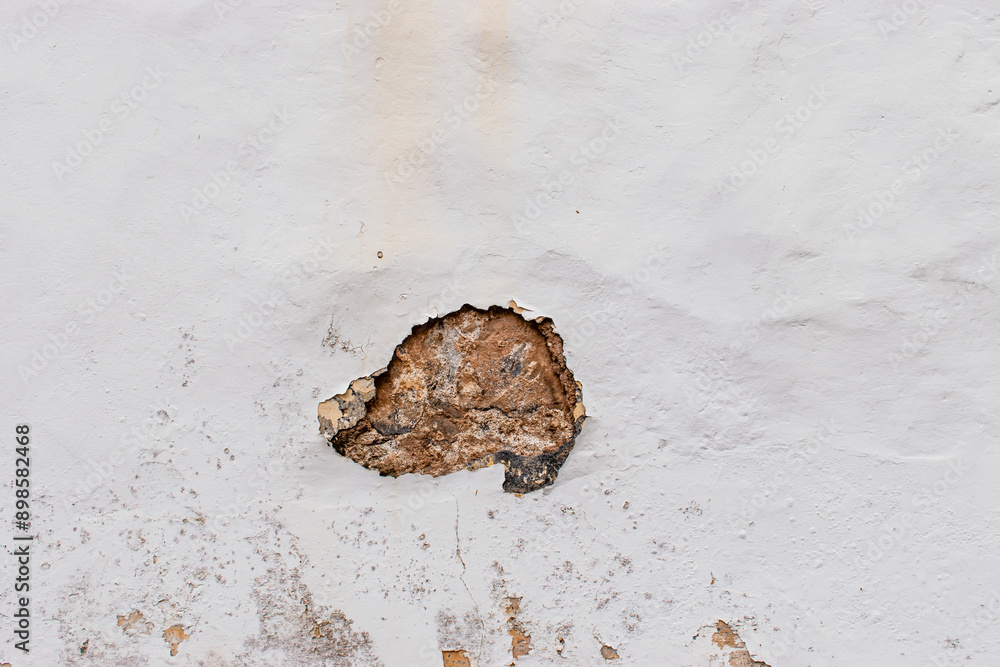 Antique wall texture in weathered white color with a rustic appearance Antique wall texture in weathered white color with a rustic appearance