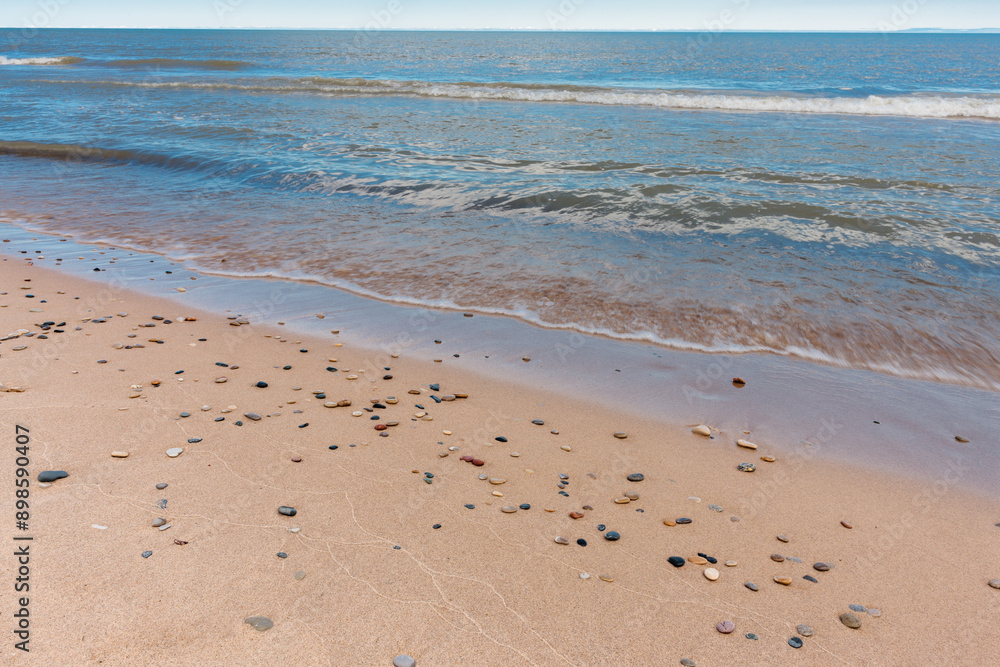 Washed up along the Lake Michigan shoreline, small stones accumulate on the beach at Kohler-Andrae State Park, Sheboygan, Wisconsin Washed up along the Lake Michigan shoreline, small stones accumulate on the beach at Kohler-Andrae State Park, Sheboygan, Wisconsin