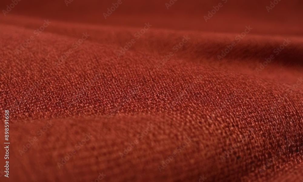 close-up of a fabric with a reddish-brown color. close-up of a fabric with a reddish-brown color.