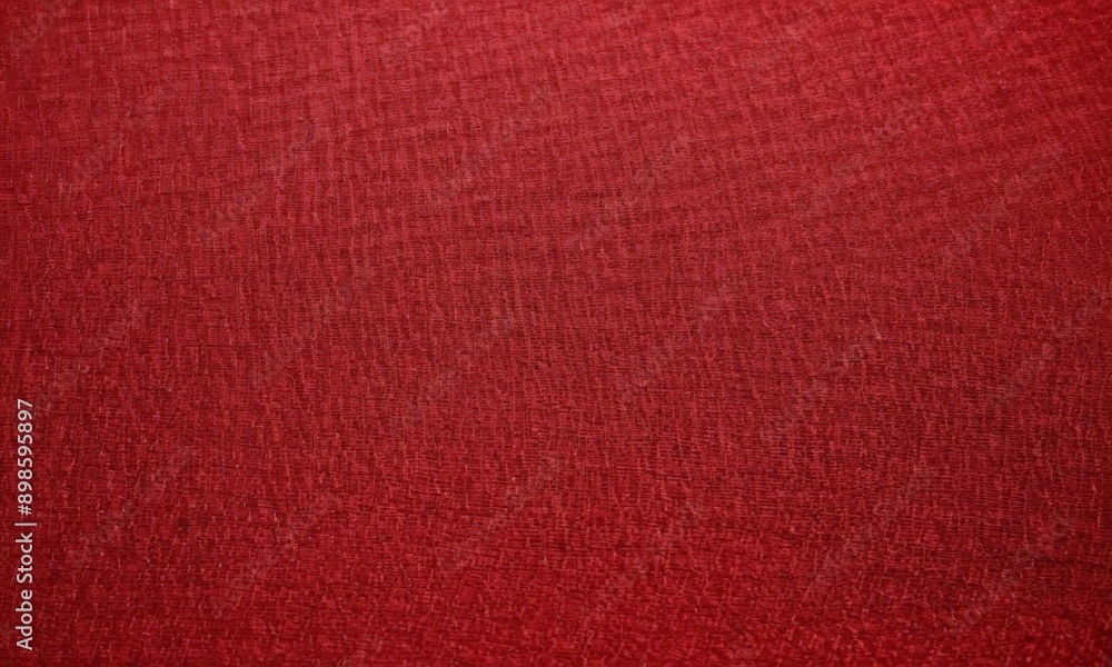 Fototapeta premium close-up of a red fabric with a textured surface.