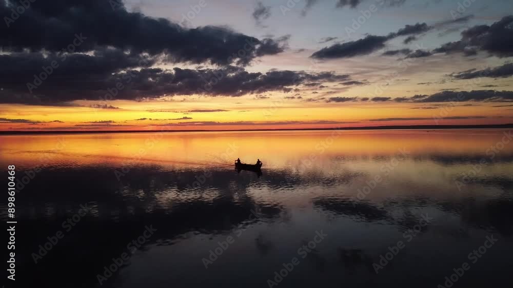 orange sunset over the lake with boat orange sunset over the lake with boat