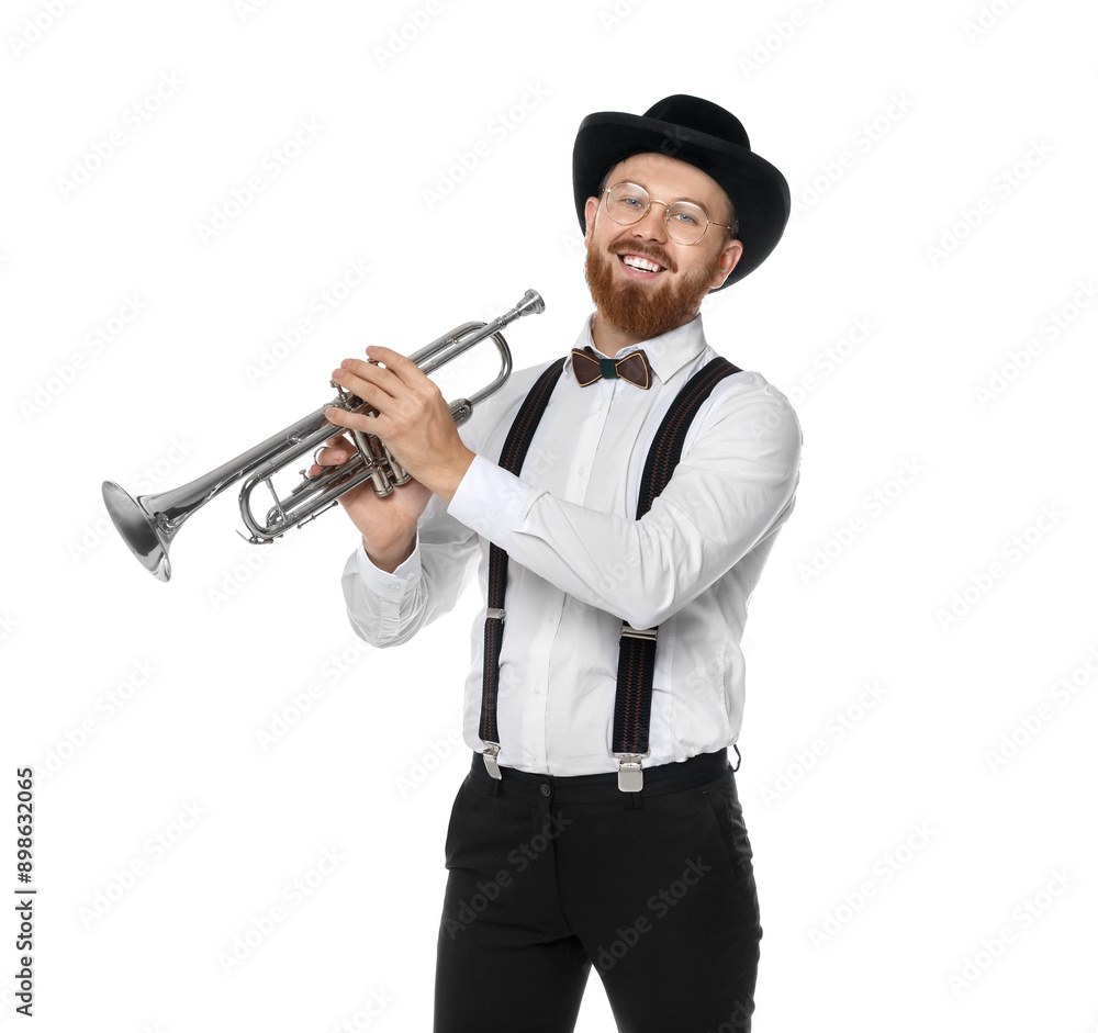 Fototapeta premium Smiling musician with trumpet on white background