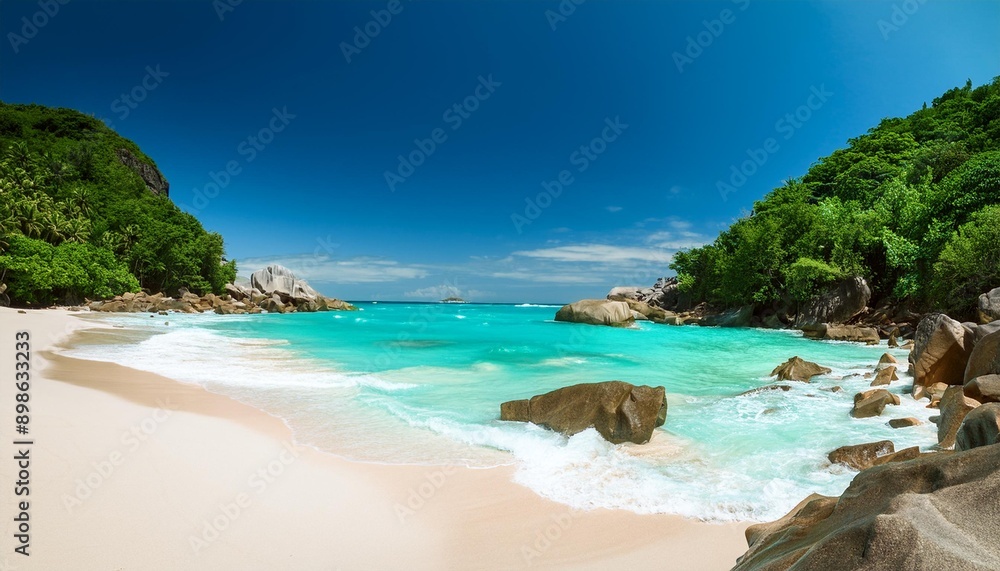 Obraz premium Una playa tropical con arena blanca y aguas turquesas