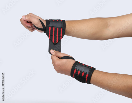 red and black stripes Wrist Supporter for Gym Wrist support with model hands isolated  