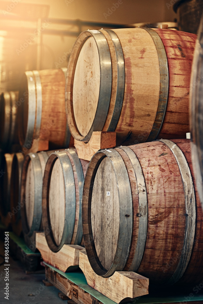 Barrels, wine cellar and storage of alcohol in distillery, manufacturing process and fermentation. Container, basement and factory for product in storehouse, vintage liquor and selection of beverage Barrels, wine cellar and storage of alcohol in distillery, manufacturing process and fermentation. Container, basement and factory for product in storehouse, vintage liquor and selection of beverage