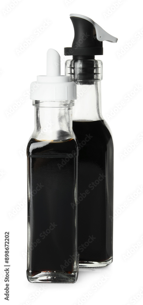 Balsamic vinegar in bottles isolated on white Balsamic vinegar in bottles isolated on white