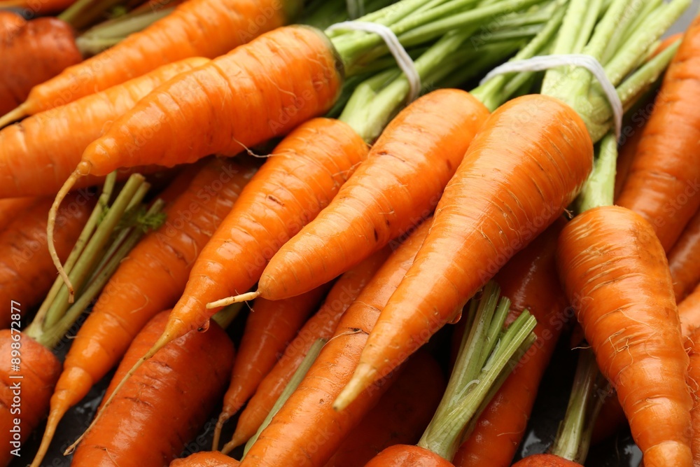 Tasty ripe juicy carrots on table, closeup Tasty ripe juicy carrots on table, closeup