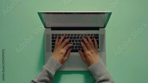 Hands Typing on Laptop photo