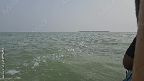 Realtime side view of surface from a boat at Chilika Lake. Odisha state on the east coast of India. 4k Resolution photo