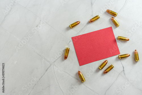 empty red note note with bullets and copyspace to the left on white marble background photo