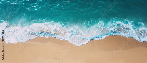  From above, waves crash rhythmically against the sandy shore, while a boat bobbles in the water below