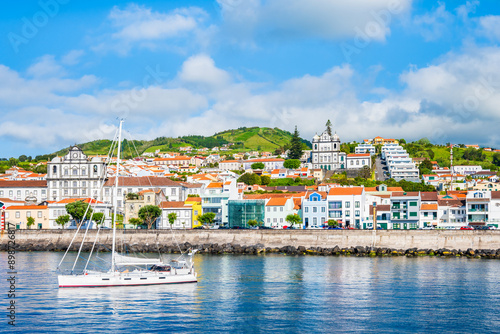 View of Horta town with white houses and church on coast of Faial island, Azores, Portugal photo