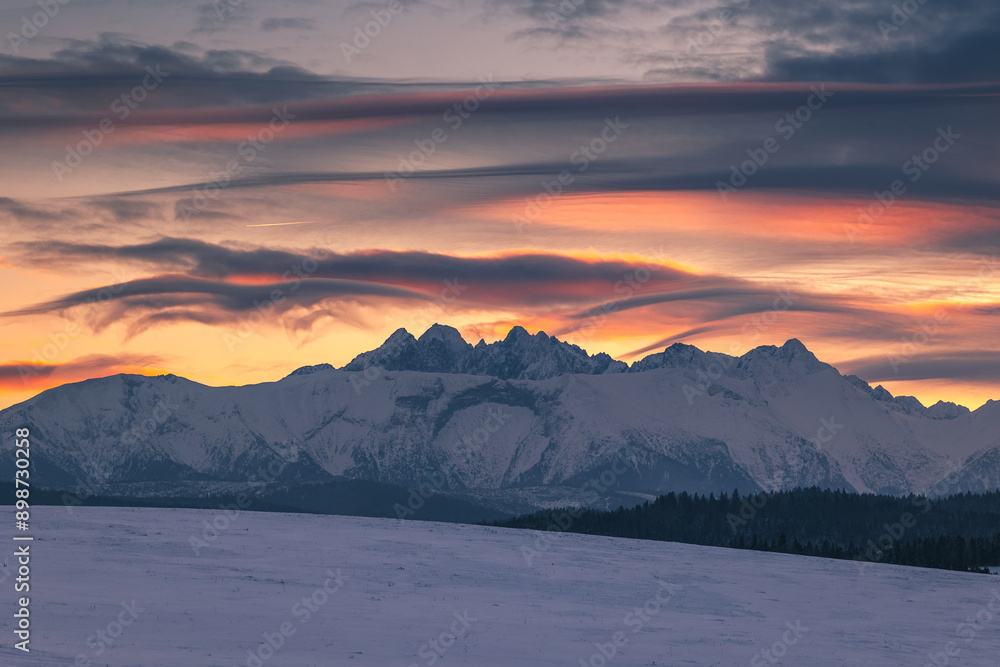 Fototapeta premium Winter views of the Tatra peaks seen from the Polish side. The Tatra National Park in its winter attire makes an incredible impression.