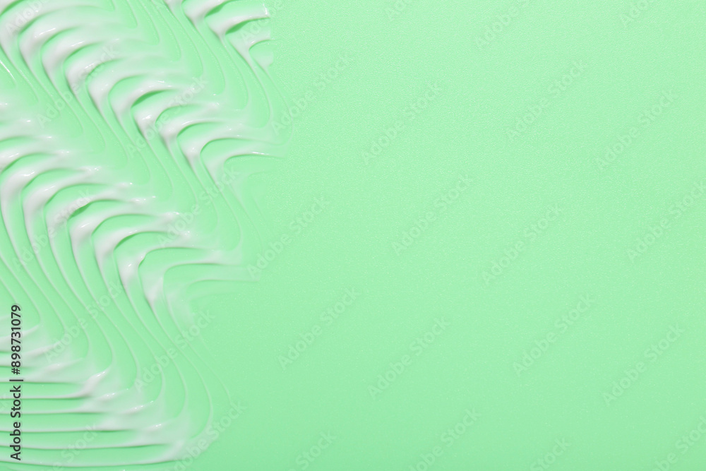 Face cream on green background, top view. Space for text Face cream on green background, top view. Space for text