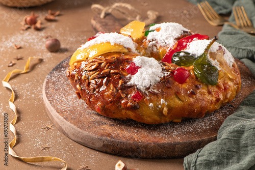 Schilderij op canvas Bolo do Rei or King s Cake, Made for Christmas, Carnavale or Mardi Gras with Christmas season elements in Background