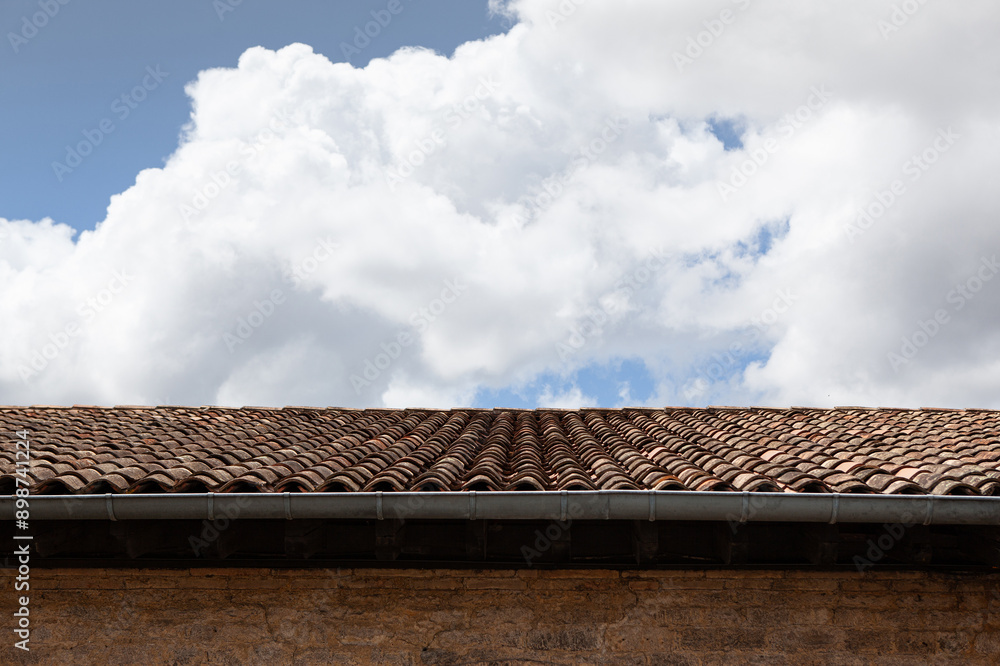 Old roof and blue sky with clouds Old roof and blue sky with clouds