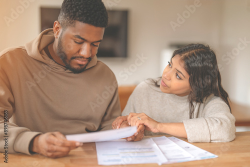 Wallpaper Mural Couple Reviewing Finances at Home Torontodigital.ca
