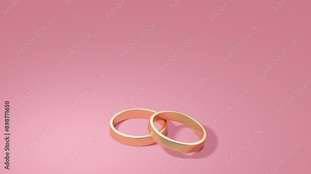 Two gold wedding rings on a pink background. Minimal modern motion design. Abstract animation Two gold wedding rings on a pink background. Minimal modern motion design. Abstract animation