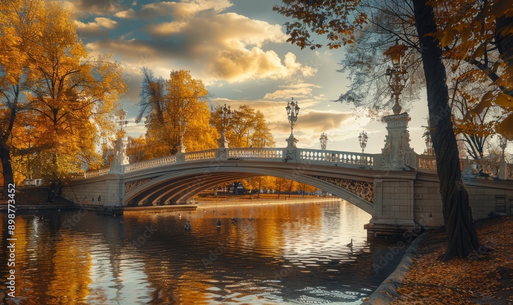 Obraz premium Bridge against the autumn sky, historic architecture, golden hues, serene scene