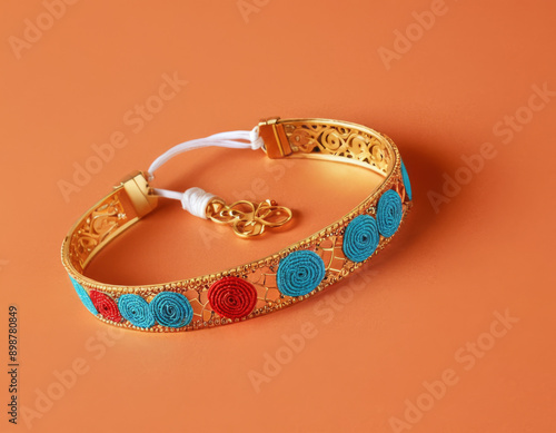 Premium Rakhi Bracelet style, made of Gold Gems and stones, indian festival Raskhan bandhan photo