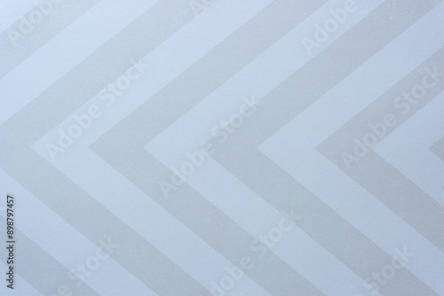 scrapbooking paper arranged with pattern forming large chevrons