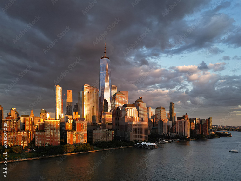 Obraz premium Cloud in NYC, New York City Skyline with dramatic sky. American Skyscrapers. Drone view of New York City skyline, cityscape of Manhattan in New York. Panoramic view on Manhattan. USA NY.
