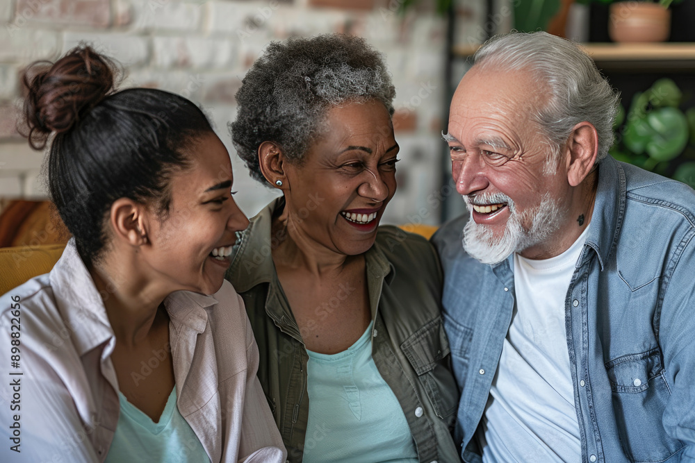Elderly couple smiling with caregiver at home care assistance Elderly couple smiling with caregiver at home care assistance